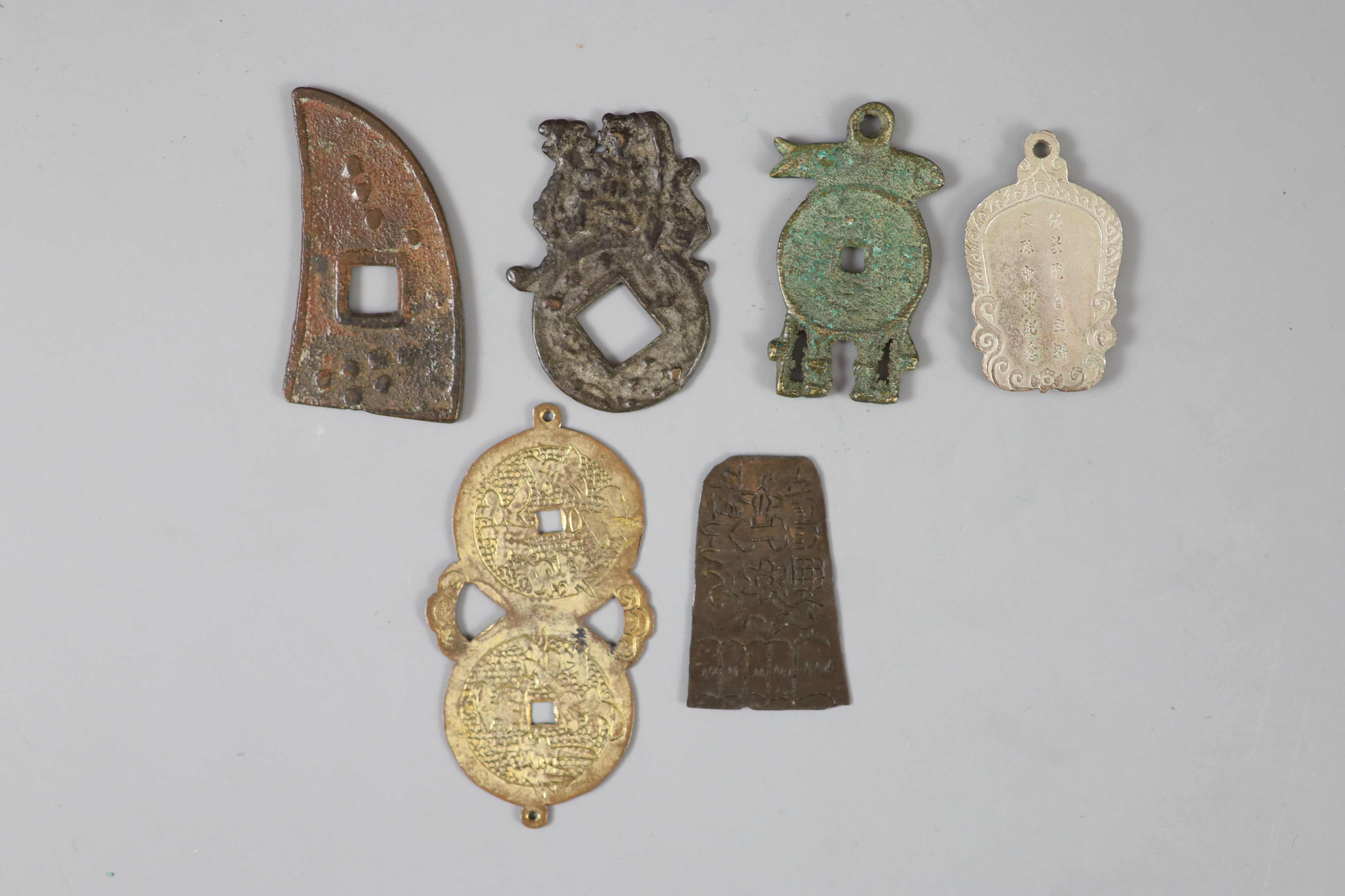 China, 5 bronze or white metal charms or amulets, Qing dynasty,